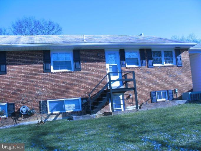 5301 Moultrie Road Springfield, VA 22151 - Photo 14 of 16 a view of house with a yard