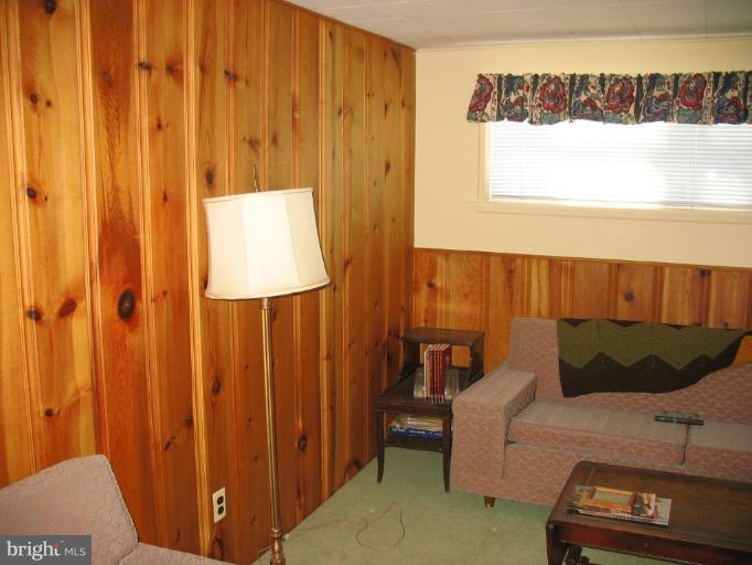 5301 Moultrie Road Springfield, VA 22151 - Photo 8 of 16 a living room with a couch and a table