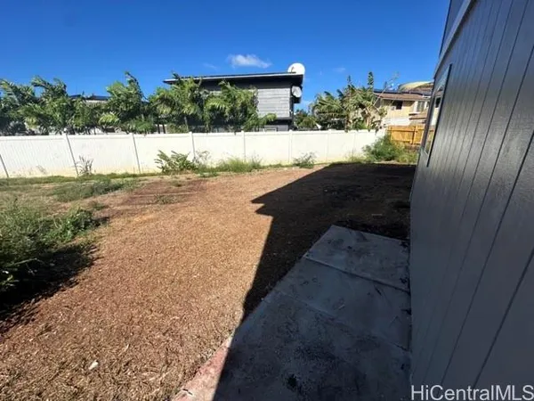 a view of a back yard from a balcony