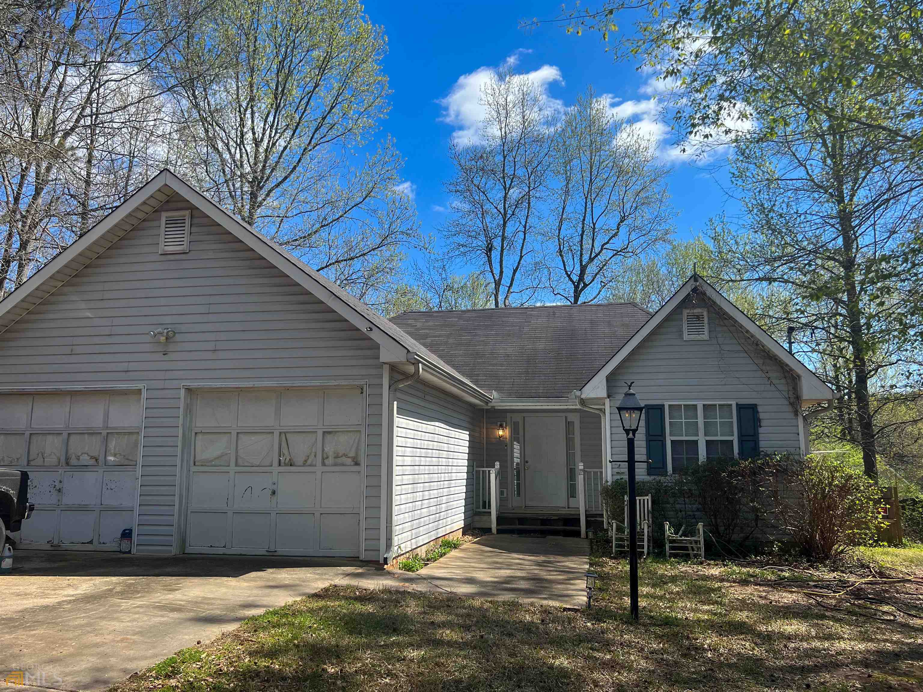 247 Taylors Gin Road Temple, GA 30179 - Photo 1 of 1 a front view of a house with a yard and garage