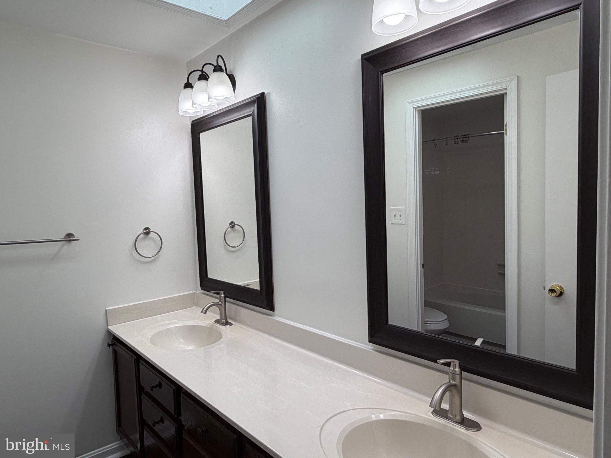 2121 Whisper Way Reston, VA 20191 - Photo 28 of 61 Elegant dual-sink bathroom retreat.