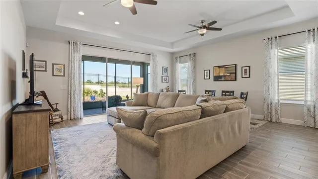a bedroom with a bed and dresser with mirror