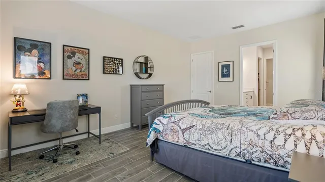 a bathroom with a toilet a sink and a mirror