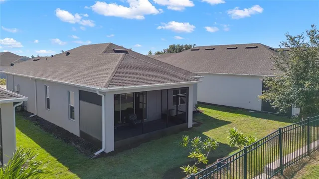 a living room with furniture and painting on the wall