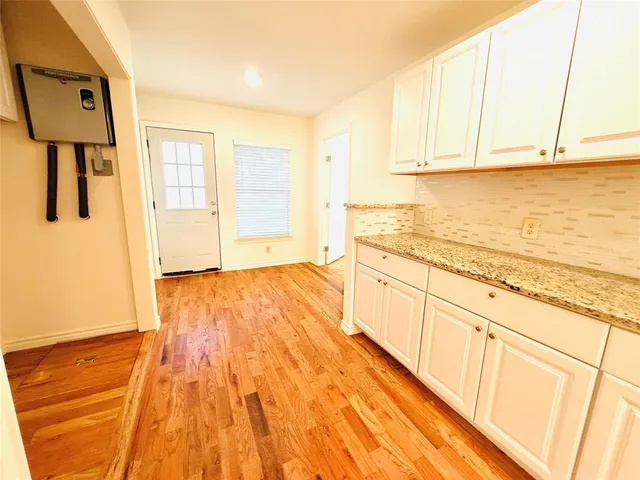 a view of a kitchen from the hallway