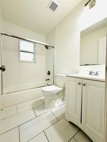a bathroom with a toilet and a sink