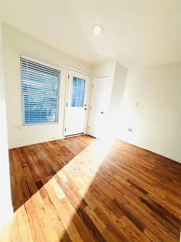 a view of kitchen with cabinets and wooden floor