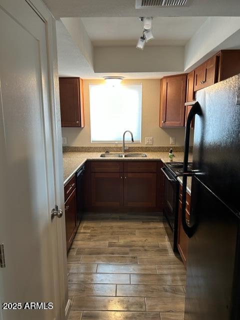 9832 East La Palma Avenue, Unit 2 Gold Canyon, AZ 85118 - Photo 11 of 24 a kitchen with stainless steel appliances granite countertop a sink stove and refrigerator
