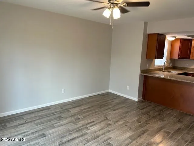 a view of kitchen with granite countertop window and a fireplace
