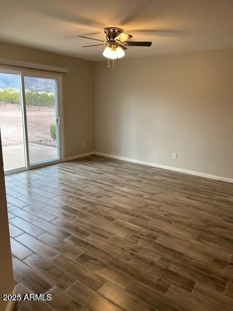 9832 East La Palma Avenue, Unit 2 Gold Canyon, AZ 85118 - Photo 8 of 24 a view of a room with wooden floor and a ceiling fan