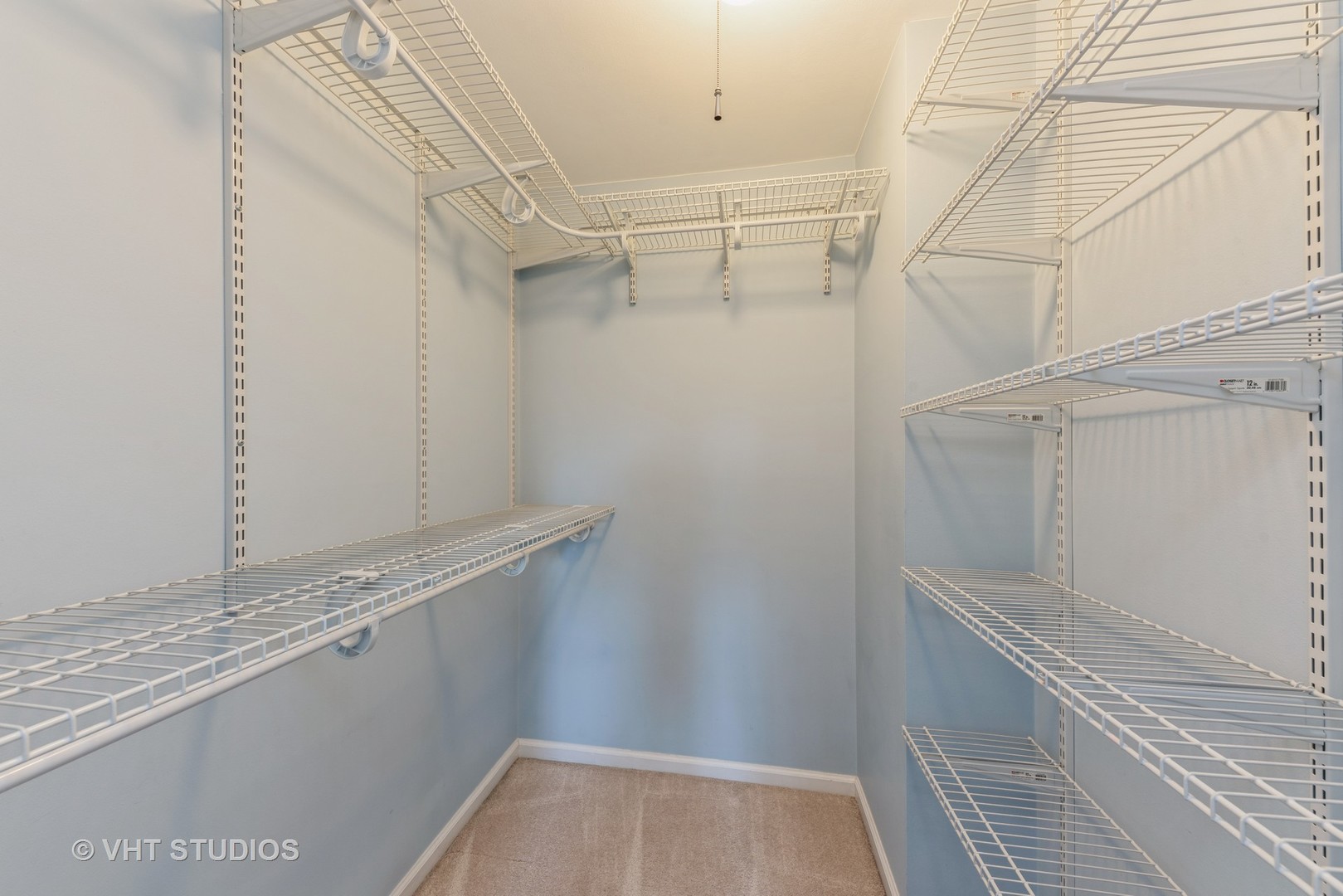 5100 Carriageway Drive, Unit 109 Rolling Meadows, IL 60008 - Photo 8 of 12 a view of a room with racks on the wall