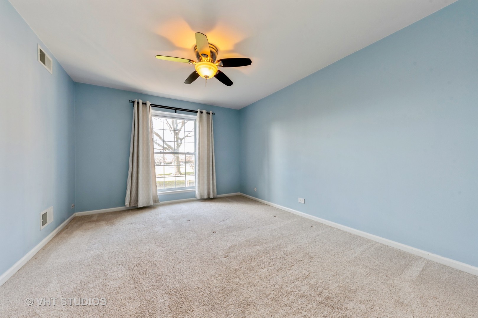 5100 Carriageway Drive, Unit 109 Rolling Meadows, IL 60008 - Photo 9 of 12 a view of an empty room with a window
