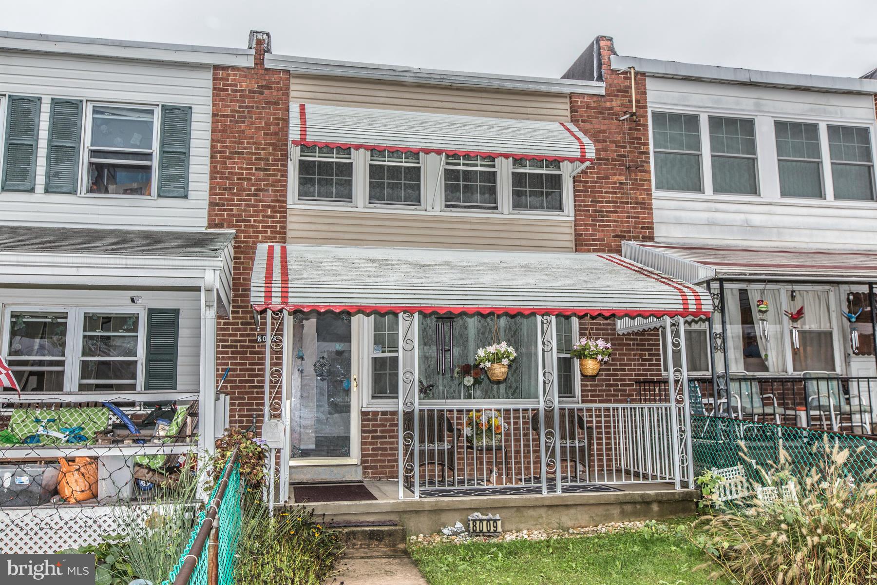 8009 Wynbrook Road Baltimore, MD 21224 - Photo 1 of 27 front view of house with a small window