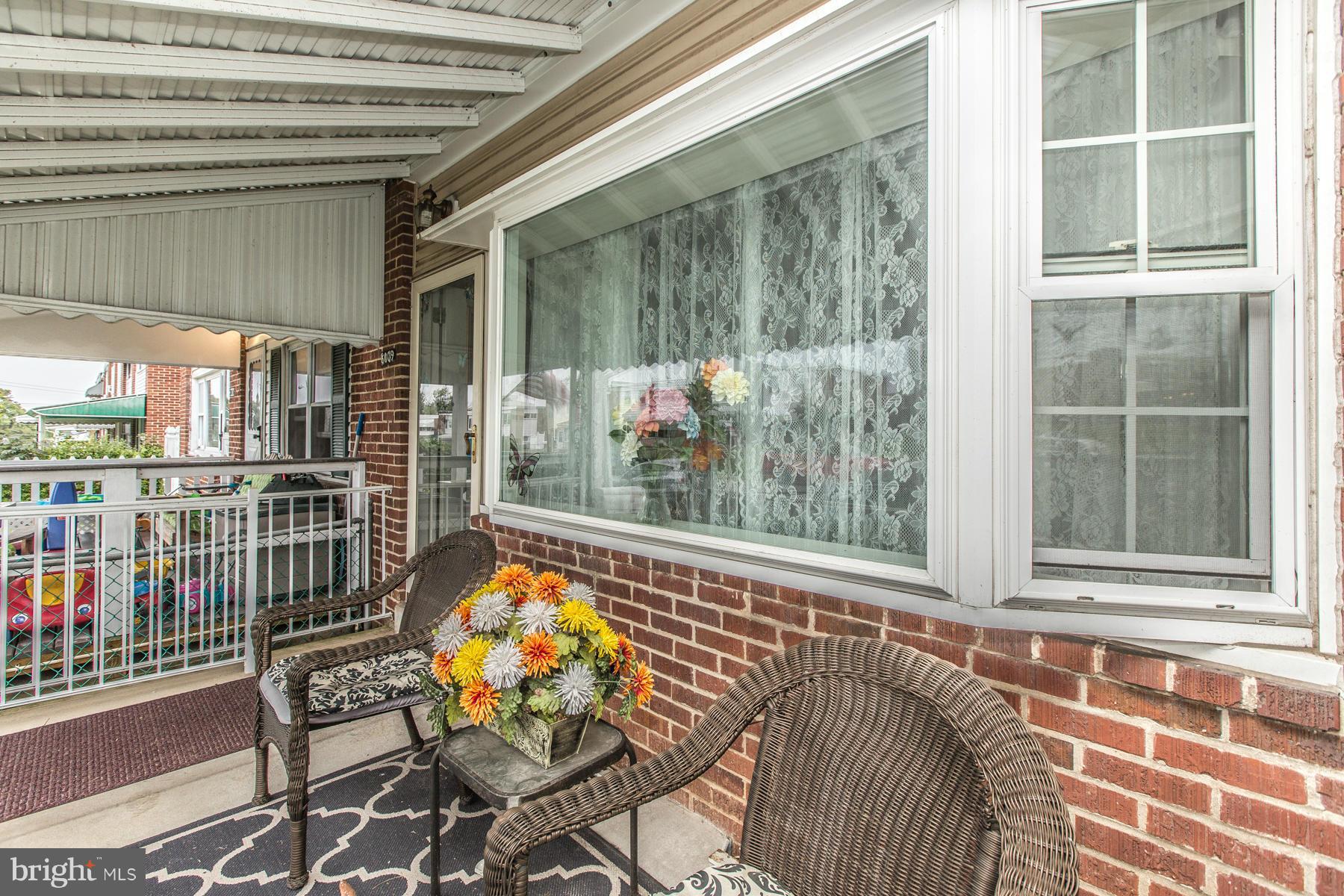 8009 Wynbrook Road Baltimore, MD 21224 - Photo 2 of 27 a view of a balcony with chair and table