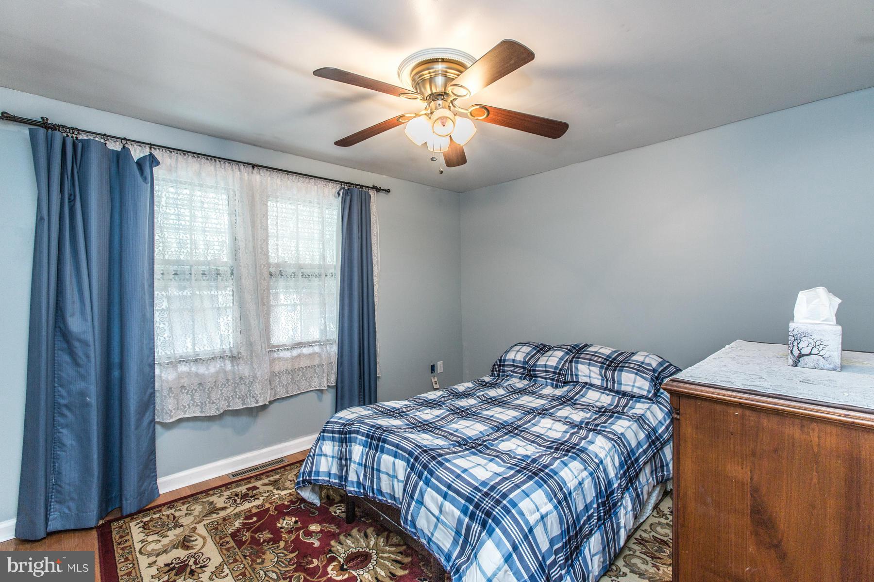 8009 Wynbrook Road Baltimore, MD 21224 - Photo 11 of 27 a bedroom with a bed and window