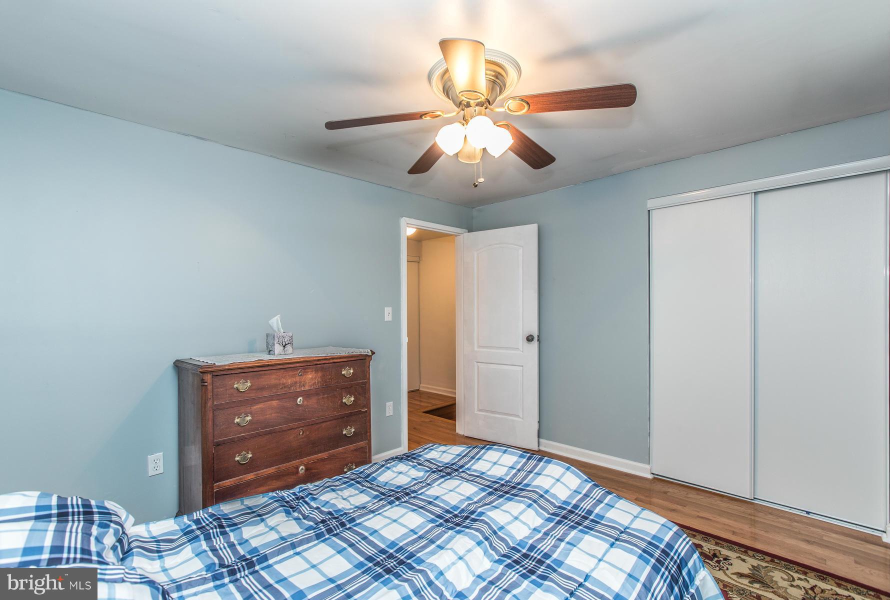 8009 Wynbrook Road Baltimore, MD 21224 - Photo 12 of 27 a view of room with cabinet and ceiling fan