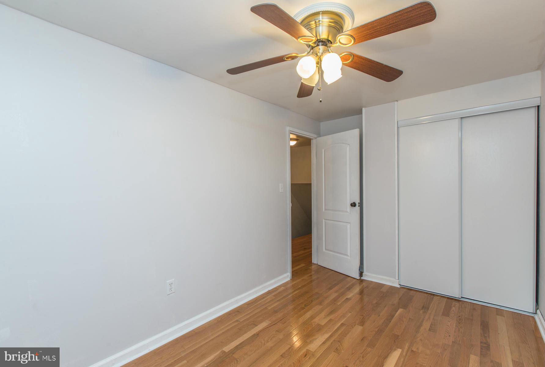 8009 Wynbrook Road Baltimore, MD 21224 - Photo 15 of 27 wooden floor in an empty room