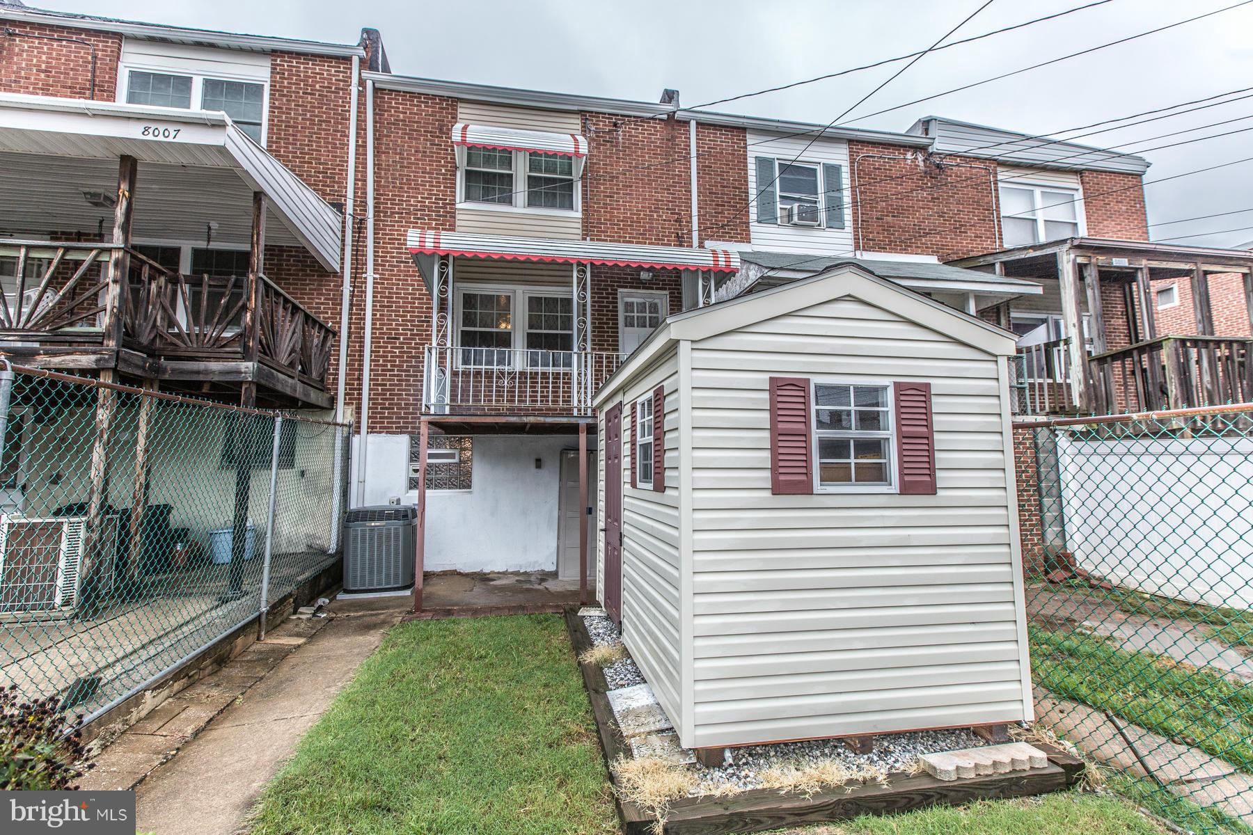8009 Wynbrook Road Baltimore, MD 21224 - Photo 23 of 27 a view of a house with a yard