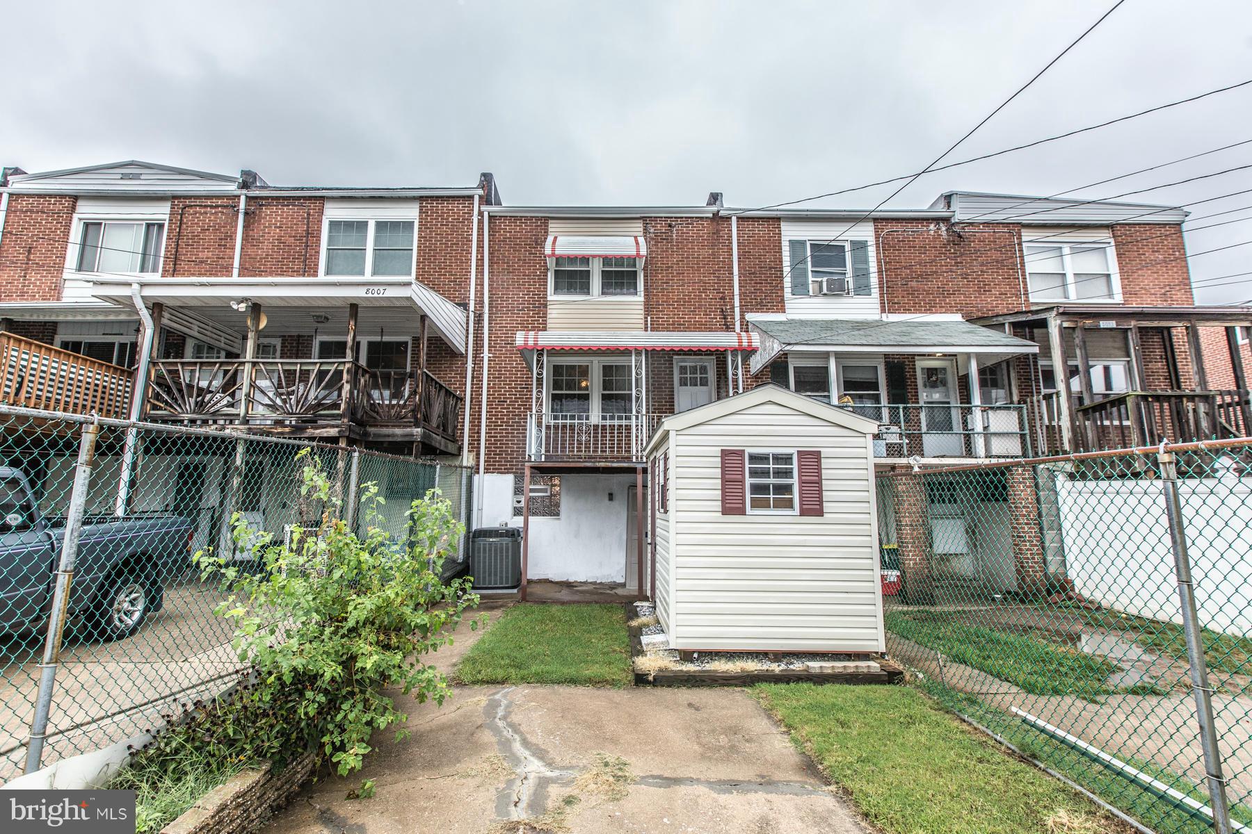 8009 Wynbrook Road Baltimore, MD 21224 - Photo 24 of 27 a front view of a house with a yard