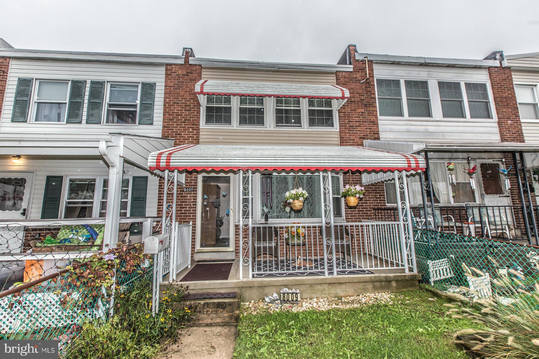 8009 Wynbrook Road Baltimore, MD 21224 - Photo 27 of 27 front view of a house with a small yard