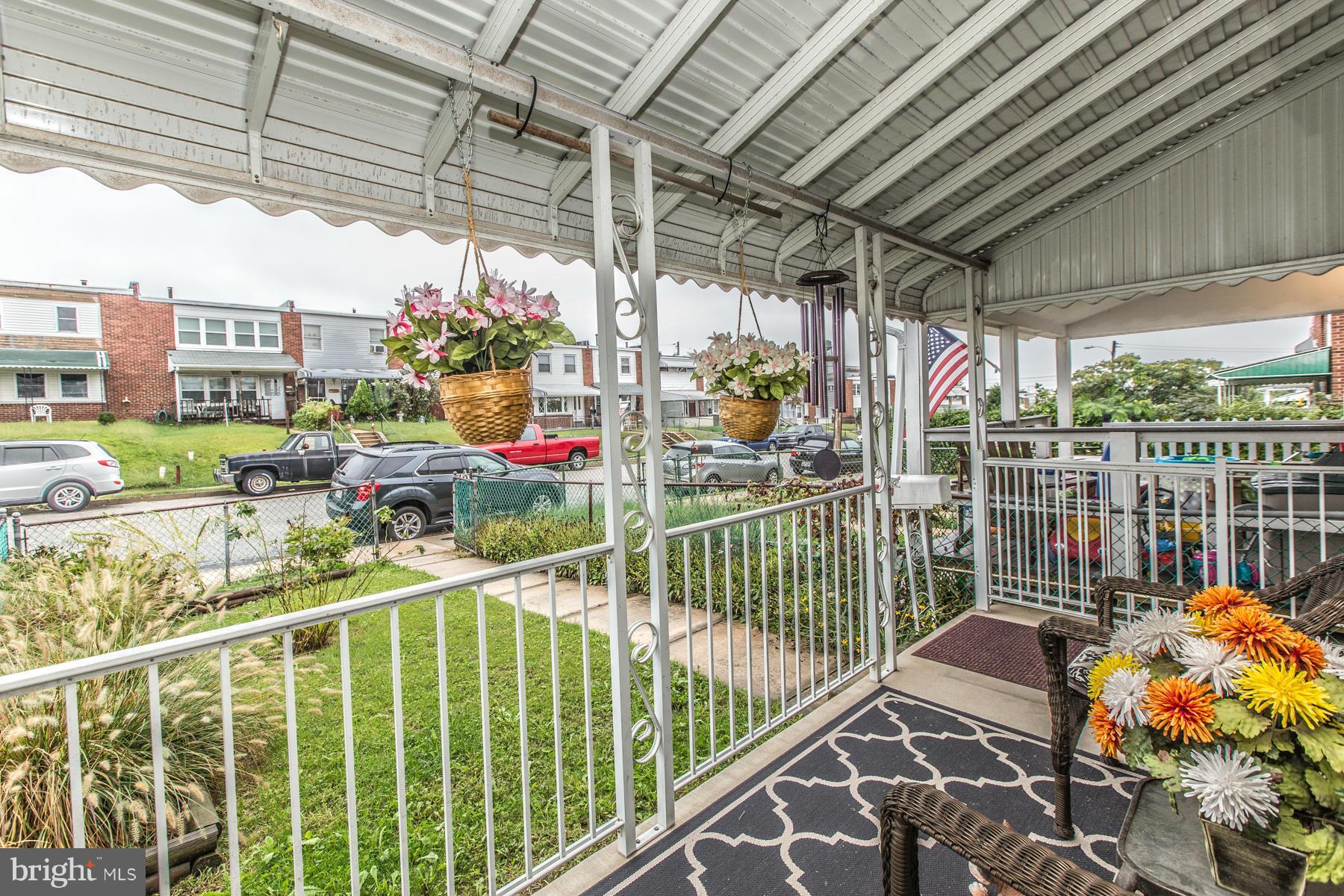 8009 Wynbrook Road Baltimore, MD 21224 - Photo 4 of 27 a view of a porch with furniture and next to a window