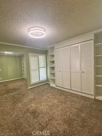 an empty room with a empty space and windows