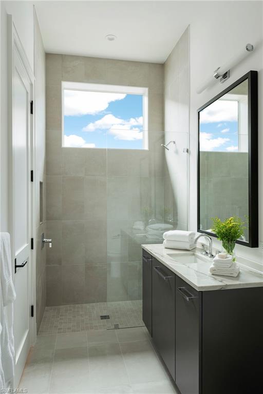 6704 Newport Road Naples, FL 34109 - Photo 22 of 47 a bathroom with a sink and a mirror