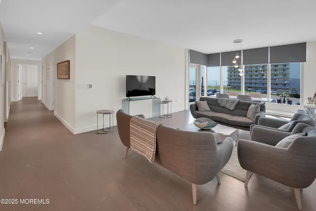 a living room with furniture and a table