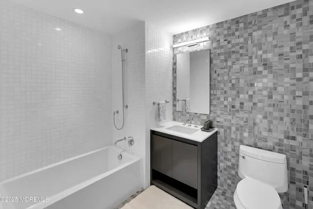 a bathroom with a sink double vanity and a mirror