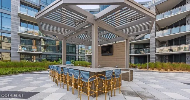 a living room with kitchen island furniture and a kitchen