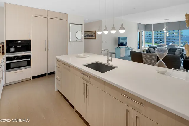 a view of kitchen with cabinets and wooden floor