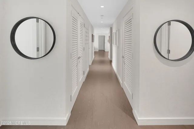 a kitchen with a sink a counter and chairs
