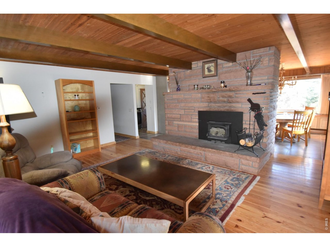 1477 Kiowa Road Lyons, CO 80540 - Photo 3 of 45 Living Room-Lopi wood burning fireplace insert.