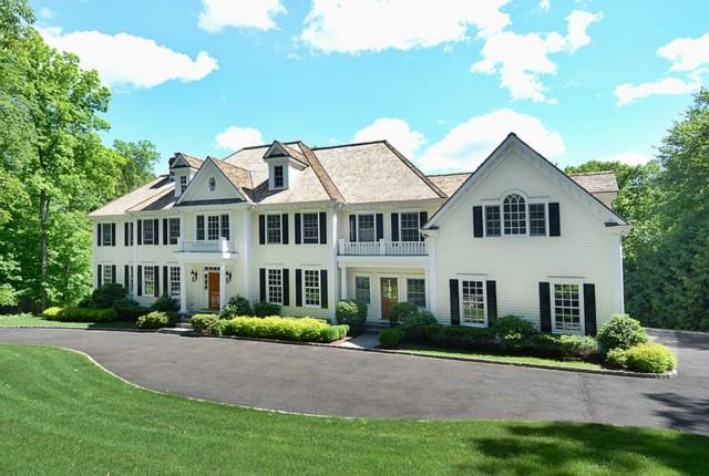 418 Michigan Road New Canaan, CT 06840 - Photo 1 of 1 a front view of a house with a garden