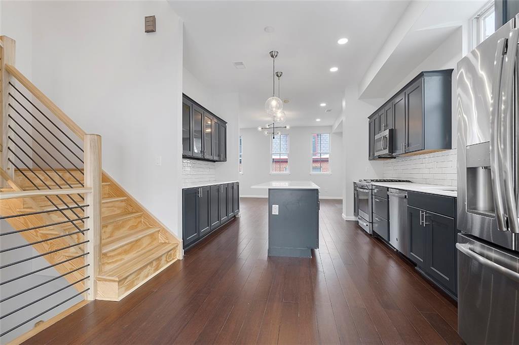 26 Jacksonia Street Pittsburgh, PA 15212 - Photo 10 of 25 Open concept main floor runs from the HUGE 20X16 composite through to the living area