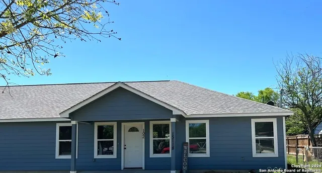 a view of backyard with green space