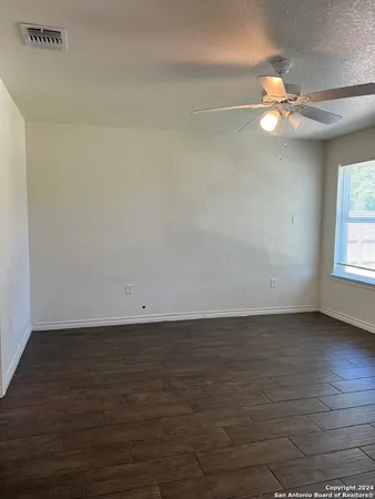 a view of a livingroom with a fan