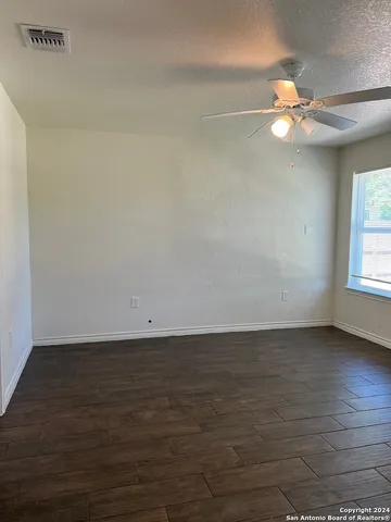 a view of a livingroom with a fan
