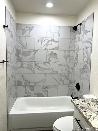 a bathroom with a sink and a bathtub