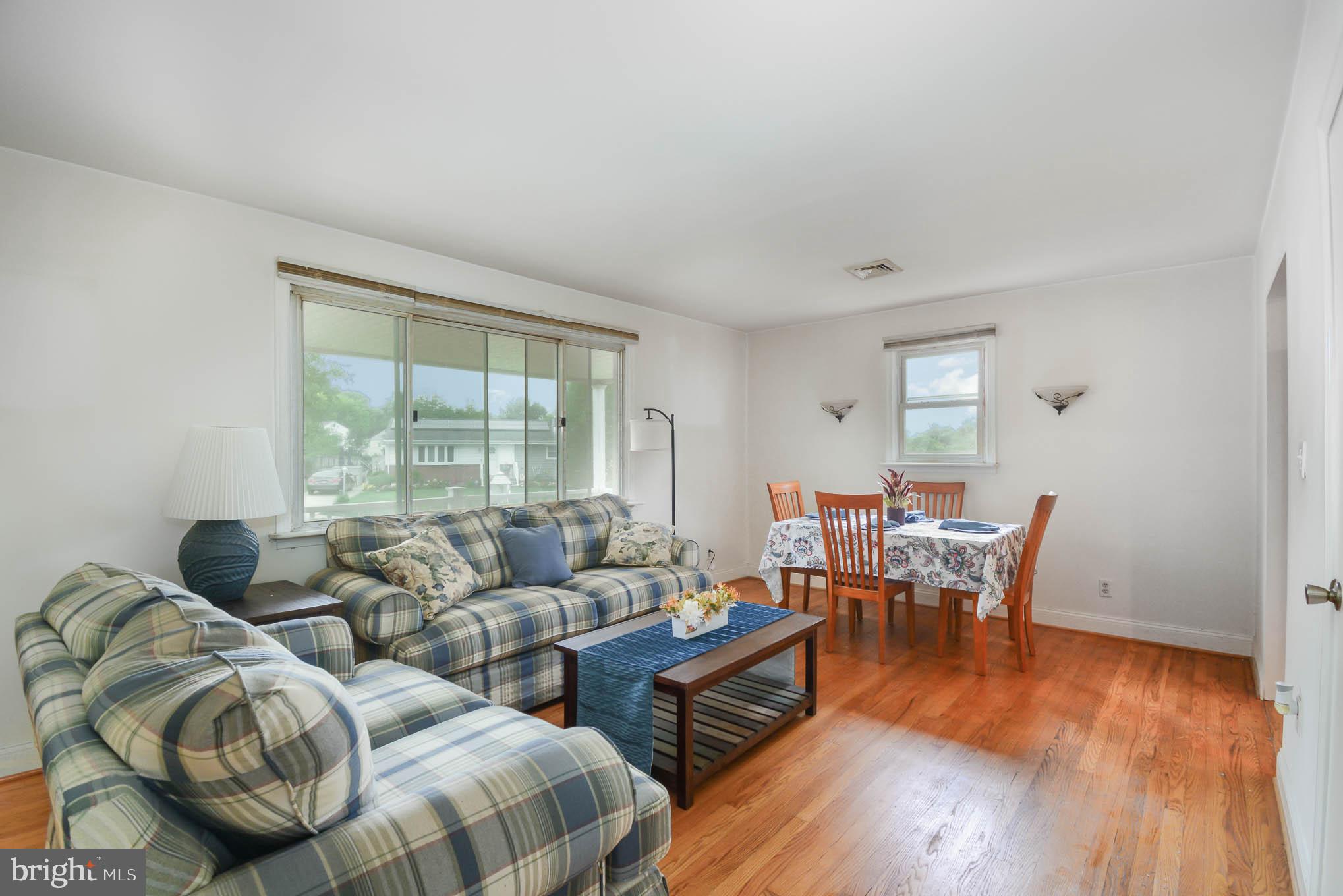 204 Cheddington Road Linthicum Heights, MD 21090 - Photo 10 of 28 a living room with furniture and wooden floor