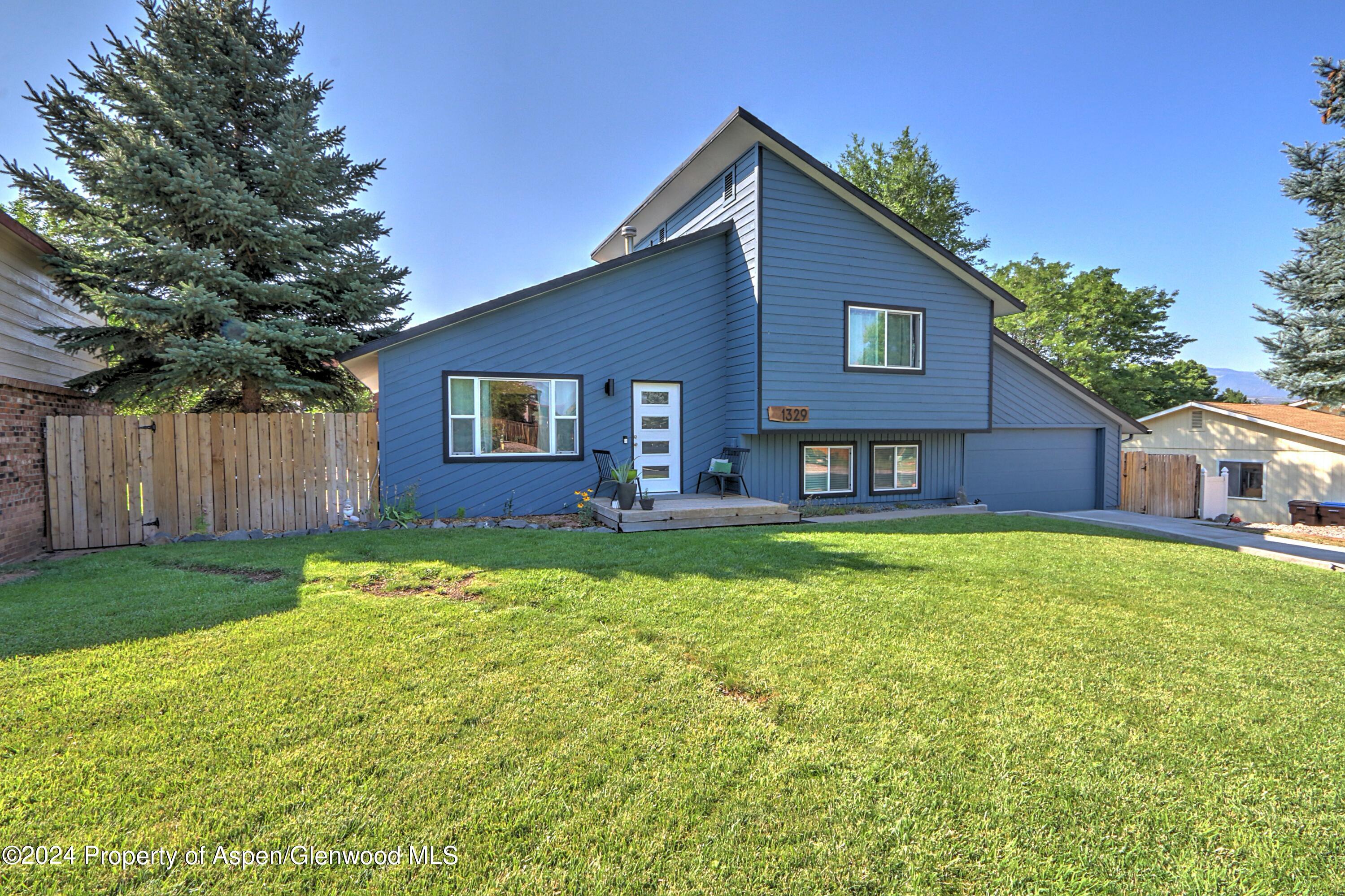 1329 East 8th Street Rifle, CO 81650 - Photo 1 of 26 a house view with a garden space