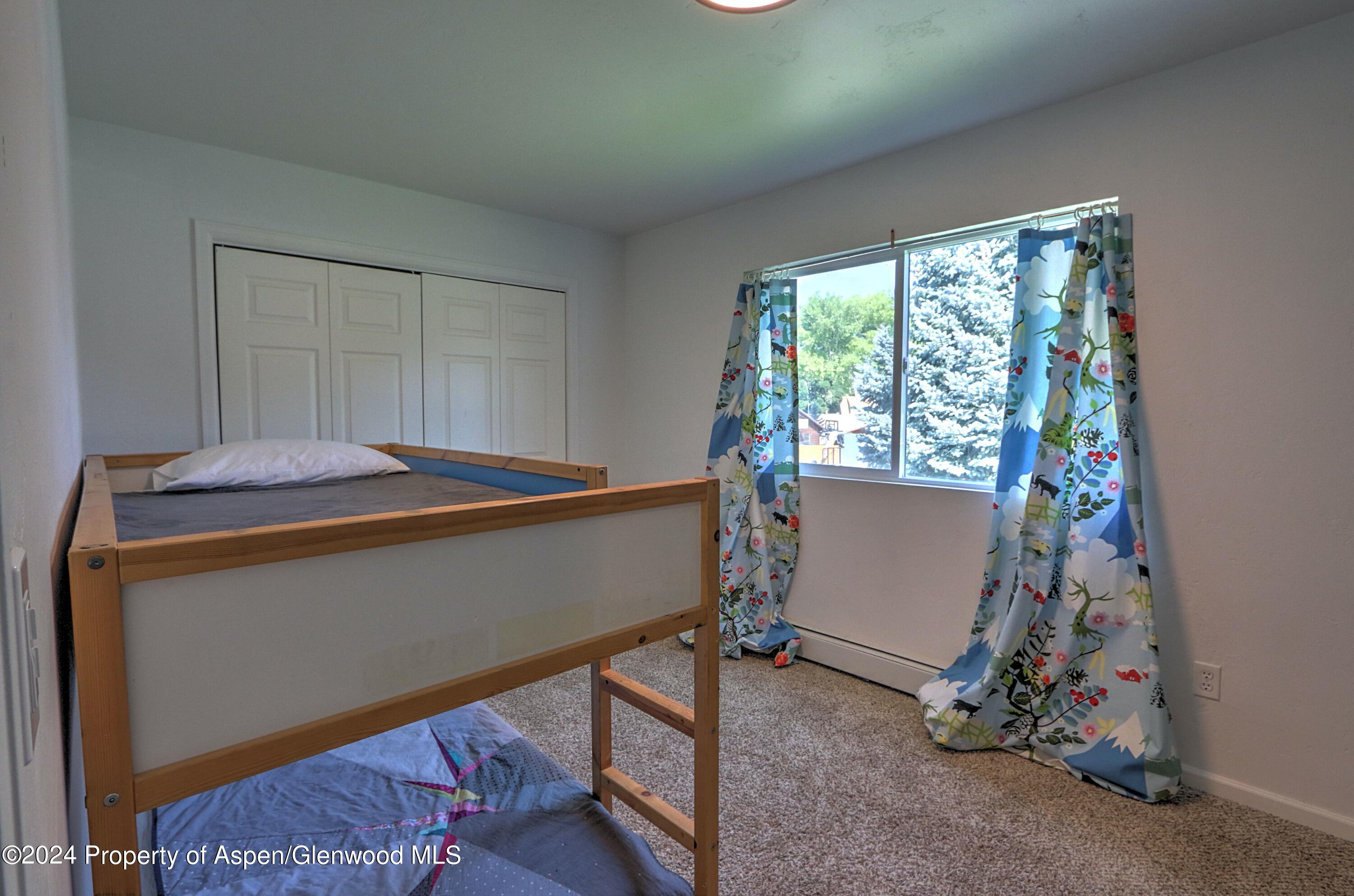 1329 East 8th Street Rifle, CO 81650 - Photo 16 of 26 a room with window and furniture