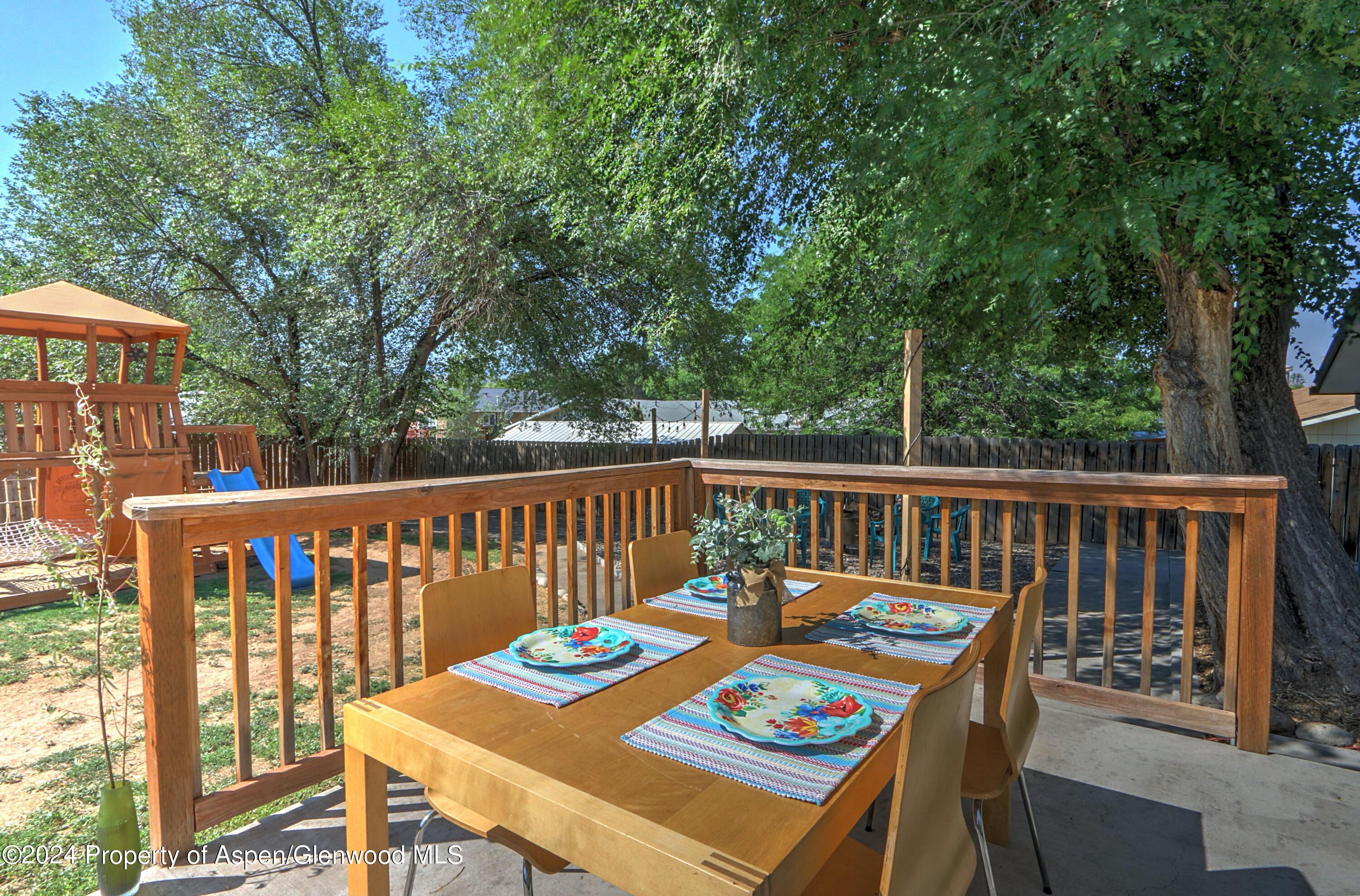 1329 East 8th Street Rifle, CO 81650 - Photo 21 of 26 a view of a chairs and table on the deck