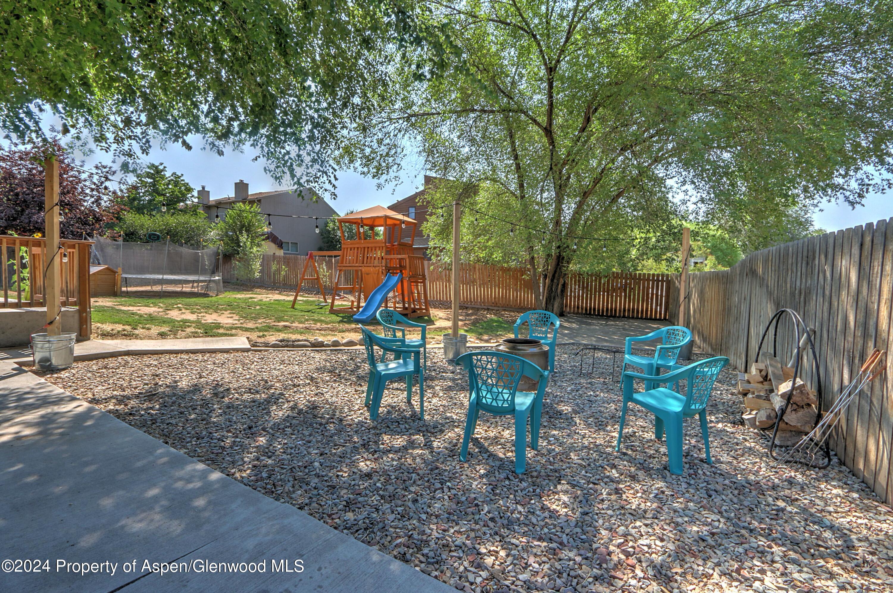 1329 East 8th Street Rifle, CO 81650 - Photo 23 of 26 a view of a park with slide a table and chairs