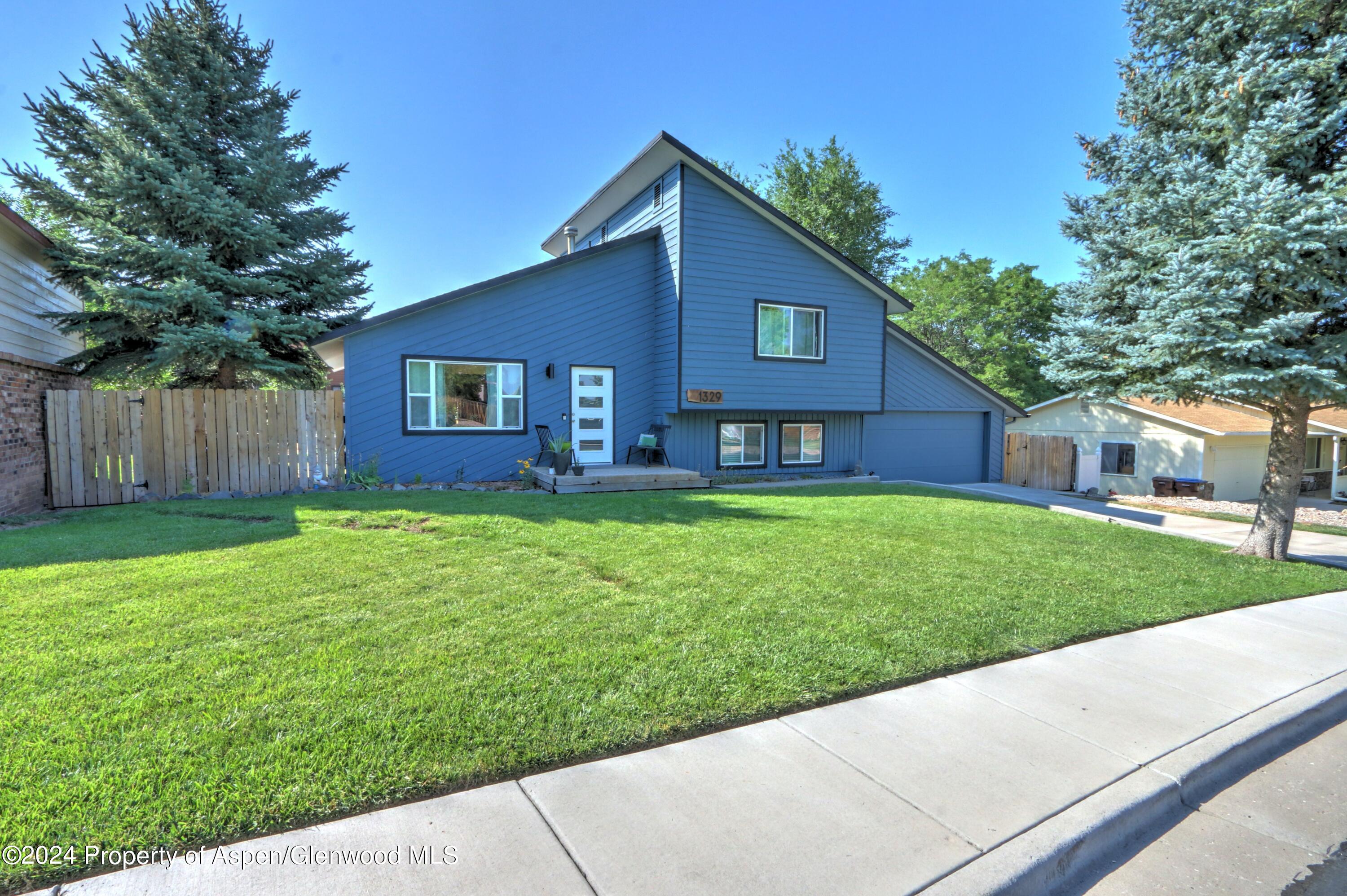 1329 East 8th Street Rifle, CO 81650 - Photo 26 of 26 a front view of a house with a yard