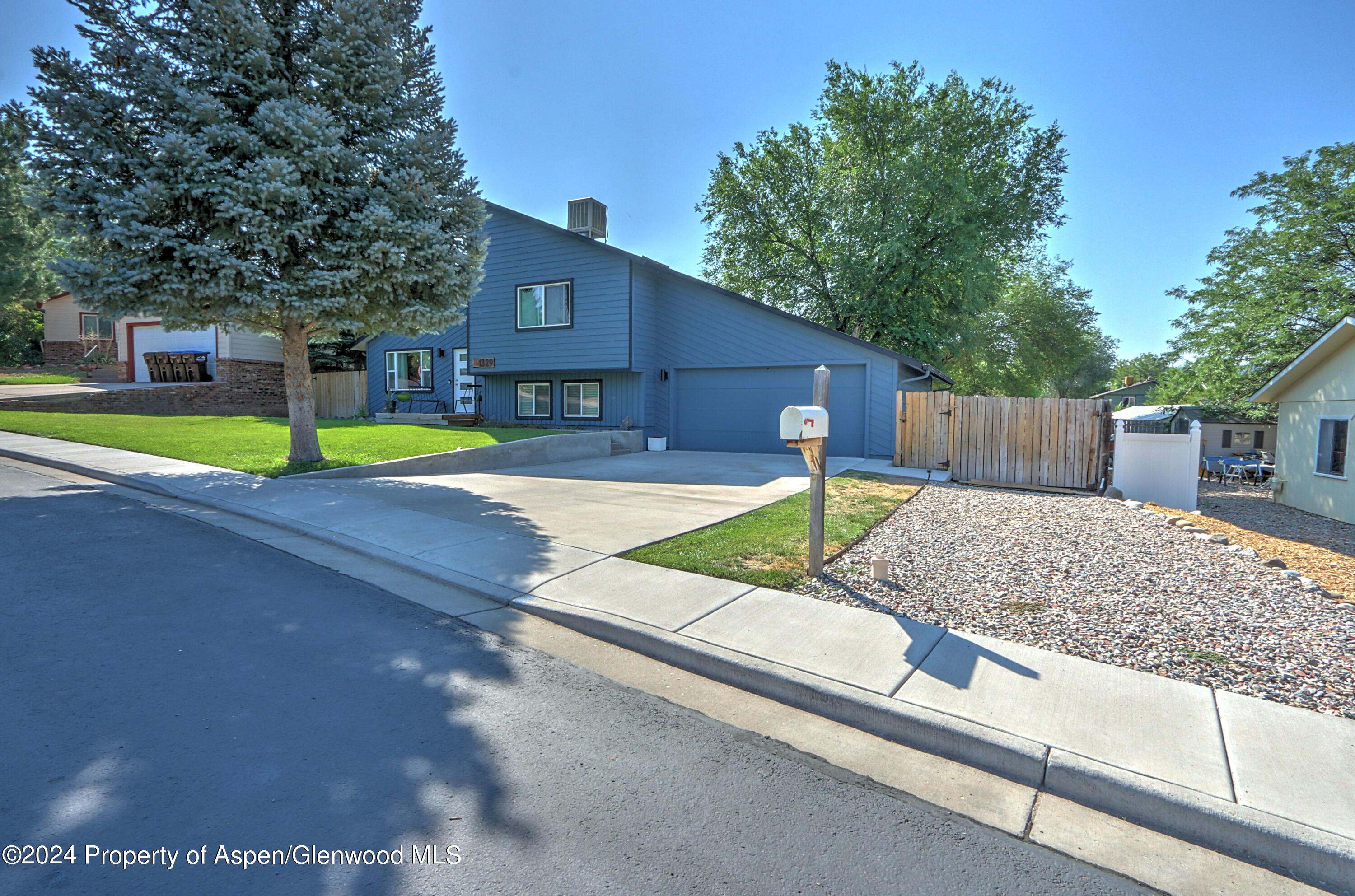 1329 East 8th Street Rifle, CO 81650 - Photo 3 of 26 a house with trees in front of it
