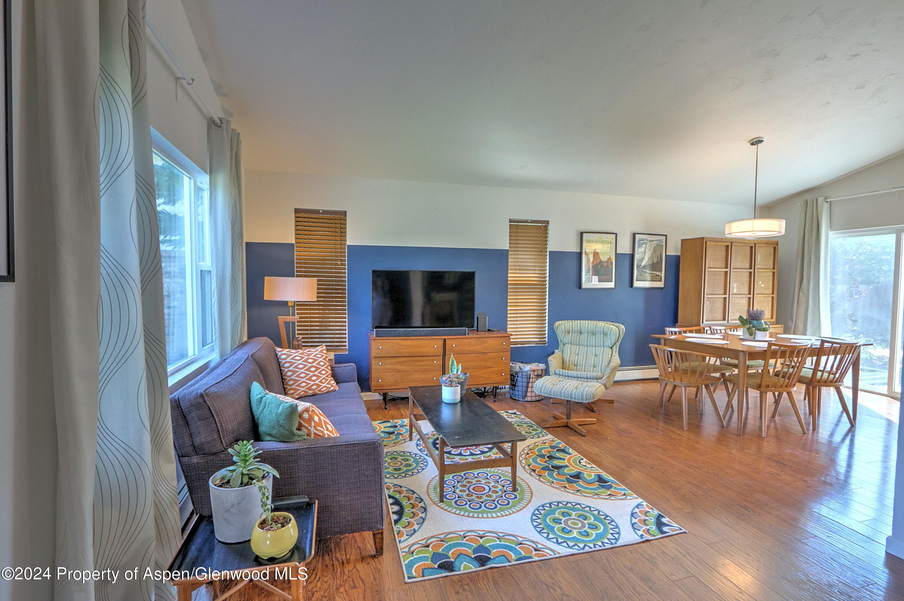 1329 East 8th Street Rifle, CO 81650 - Photo 5 of 26 a living room with furniture and wooden floor