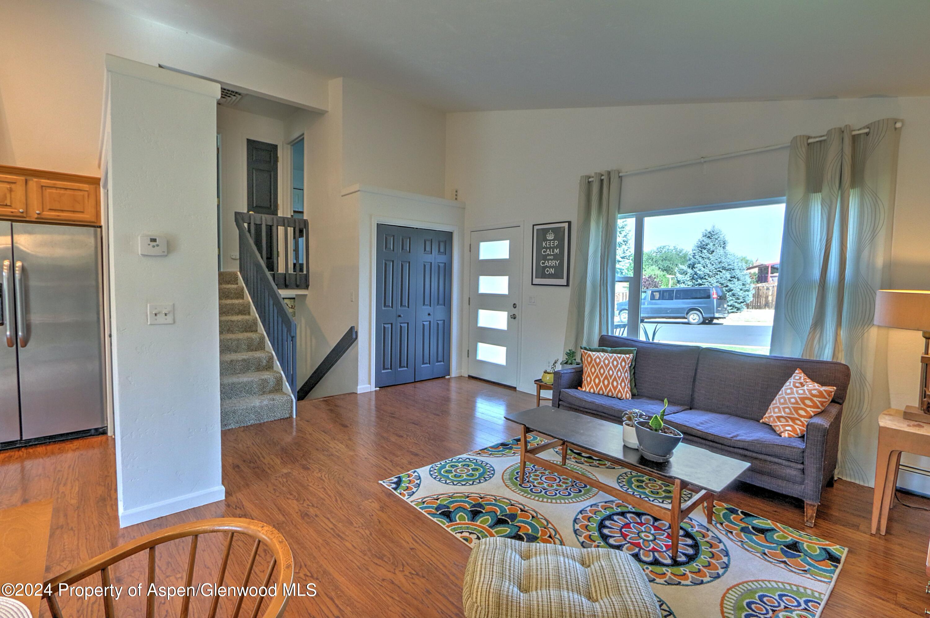 1329 East 8th Street Rifle, CO 81650 - Photo 7 of 26 a living room with furniture and a large window