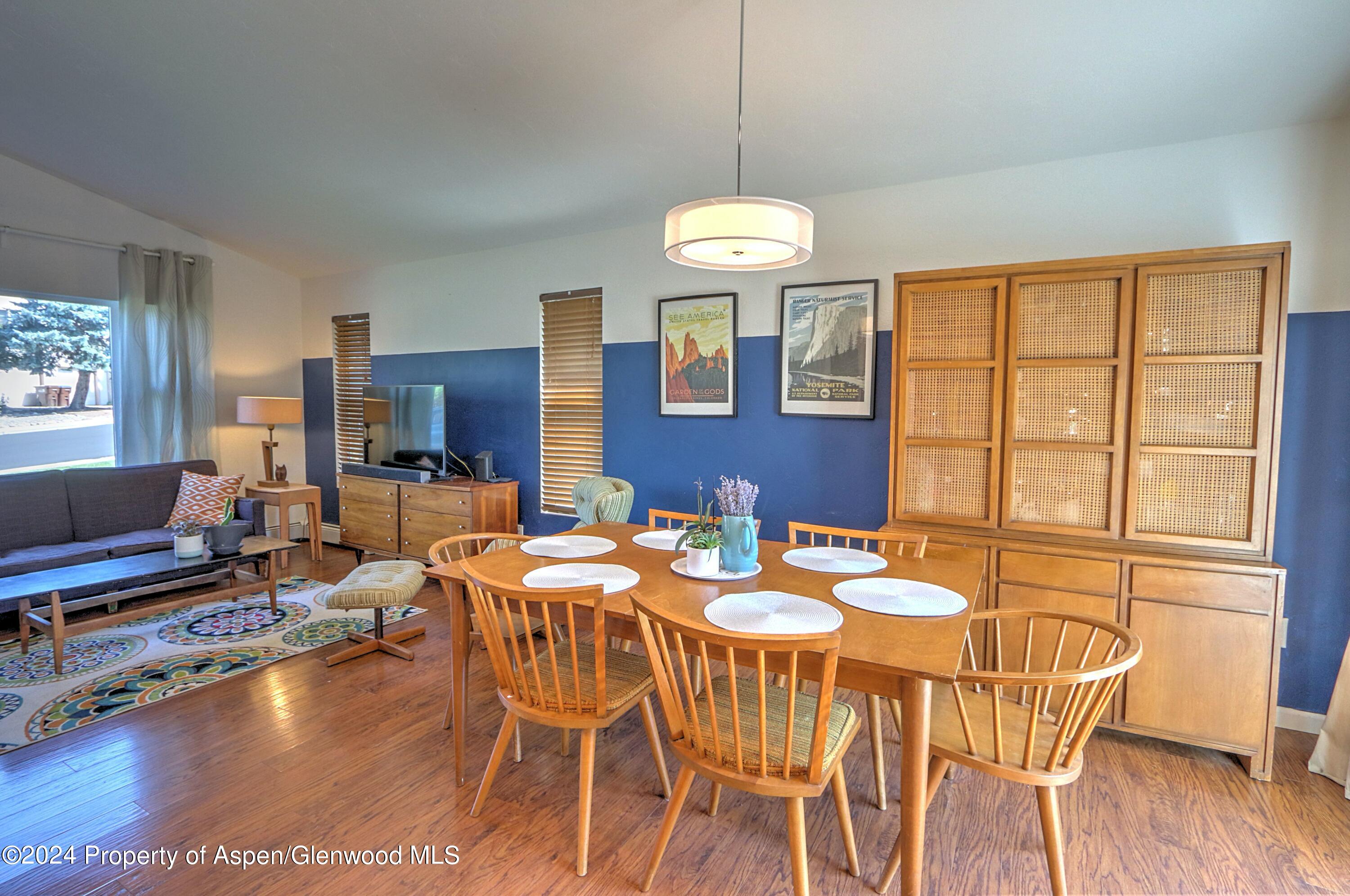 1329 East 8th Street Rifle, CO 81650 - Photo 8 of 26 a view of a dining room with furniture window and wooden floor