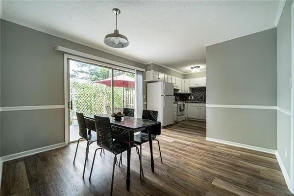 a dining room with furniture window wooden floor